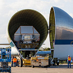 Super Guppy brings EM-1 capsule to KSC (Jared Haworth): Transport Lift in position to remove Orion from the Super Guppy