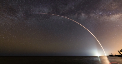 SpaceX's Falcon 9 streaks across the night sky, backdropped by the Milky Way.  Photo Credit: Michael Seeley / We Report Space