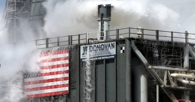 One of the "rainbirds," a water-dispersal device atop the SLS mobile launcher, blankets the launch platform with water during the final flow test at Kennedy Space Center.  Photo credit: Michael Howard / We Report Space