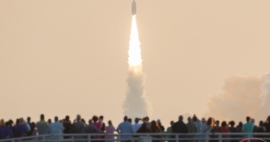 Members of the general public watch as NASA's Orion capsule launches for its "ascent-abort" test in July 2019.  The pier at Jetty Park is one of the closest, publicly accessible locations for launch viewing.  Photo credit: Michael Seeley / We Report Space