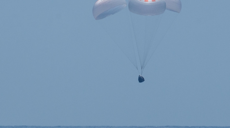 The SpaceX Crew Dragon Endeavour spacecraft is seen as it lands with NASA astronauts Robert Behnken and Douglas Hurley onboard in the Gulf of Mexico off the coast of Pensacola, Florida.  Photo credit: NASA/Bill Ingalls