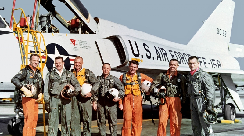 The original Mercury 7 were all test pilots. Standing in front of the U.S. Air Force Convair F-106B aircraft are Carpenter, Cooper, Glenn, Grissom, Schirra, Shepard, and Slayton. (Photo: NASA)