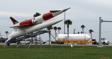 Atlas V's Centaur upper stage passes behind a recently restored Navajo missile located at the southern entrance to Cape Canaveral Space Force Station.  Photo credit: Michael Howard / We Report Space